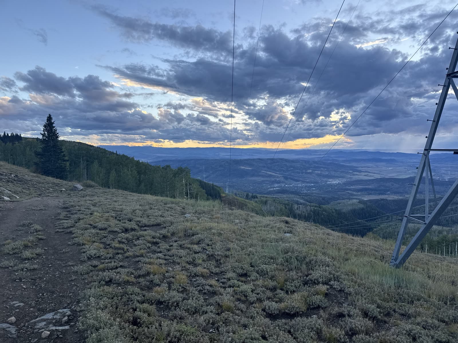 Evening trail between Billy’s Rabbit Hole and Dry Lake — dirt path, sage hillside, and sunset over the valley